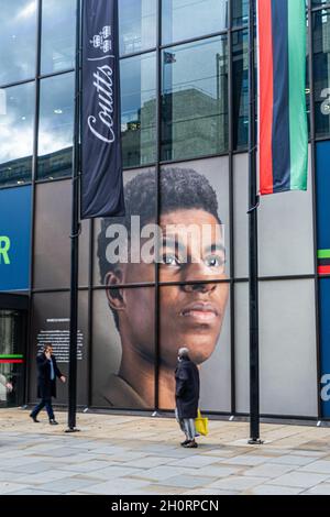 LONDON, UK. 14 Oct, 2021. Coutts private bank in The Strand celebrates Black History Month by  featuring a  large portrait of Manchester United and England footballer Marcus Rashford  with the inscription above the entrance 'Change takes true character'.Credit: amer ghazzal/Alamy Live News Stock Photo