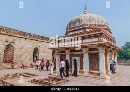 DELHI, INDIA - OCTOBER 23, 2016: Tourists visit Tomb of Imam Zamin in Qutub complex in Delhi, India. Stock Photo