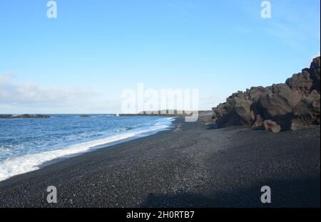 Seascape of Dritvik black sand beach in Iceland. Stock Photo