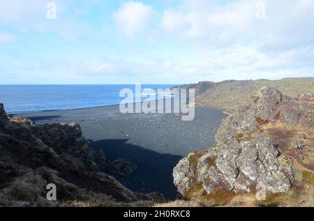 Pretty deserted black lava sand beach in Dritvik. Stock Photo