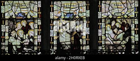 Stained glass window by the Kempe Studios depicting the Deposition, Shrouding, & Entombment of Christ, St Nicholas's Church, Islip, Northamptonshire Stock Photo