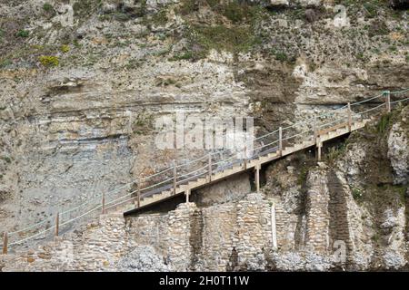 Steep steps leading to/from beach at Newquay, Cornwal .For climbing career  ladder, corporate ladder. Also housing ladder / property ladder, long climb  Stock Photo - Alamy