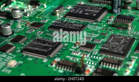 printed circuit board with surface mounted passive and active circuit components close up Stock Photo