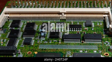 printed circuit board with surface mounted passive and active circuit components close up Stock Photo