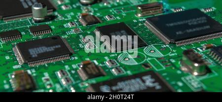 printed circuit board with surface mounted passive and active circuit components close up Stock Photo