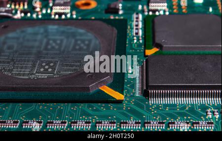 printed circuit board with surface mounted passive and active circuit components close up Stock Photo