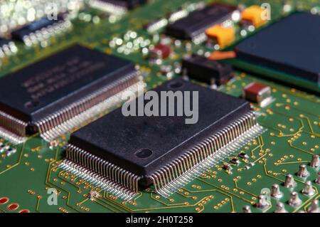 printed circuit board with surface mounted passive and active circuit components close up Stock Photo