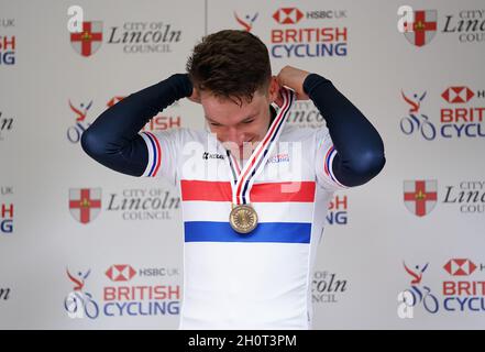 Ethan Hayter of Team Ineos Grenadiers with the gold medal on the podium after the Elite Men's Time Trial during the British Cycling National Championships Time Trial through Lincoln. Picture date: Thursday October 14, 2021. Stock Photo