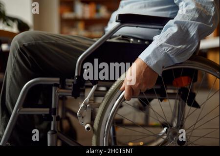 Adult disabled man in wheelchair, disability Stock Photo