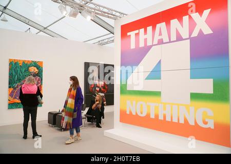 London, UK, 14 October 2021: Frieze art fair opens in London with contemporary art from around the world. 'Thanx 4 Nothing,' 2019, by John Giorno, dominates the eye with it's ranbow colours. The show has an emphasis on averting climate catastrophe both in the works shown and in the reduced carbon footprint of the fair compared to previous years.  Anna Watson/Alamy Live News