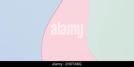 Abstract colored paper cut banner background. Minimal geometric curved shapes and lines in blue, light green, pastel pink colors Stock Photo