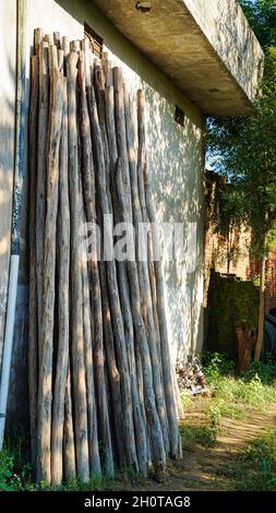 Background from scraps of old boards. Remains of planks with nails after the installation of concrete formwork. Recycling of lumber. Stock Photo