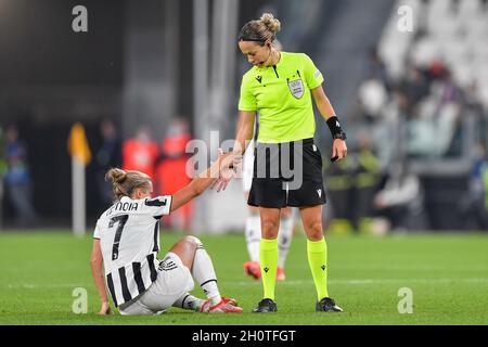 Turin, Italy. 13th Oct, 2021. Referee Ivana Martincic gives a hand to Valentina Cernoia (7) of Juventus during the UEFA Women's Champions League match between Juventus and Chelsea at Juventus Stadium in Turin. (Photo Credit: Gonzales Photo/Alamy Live News Stock Photo