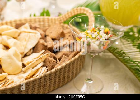 Detail of a basket with assorted breads, on a party buffet table. Stock Photo