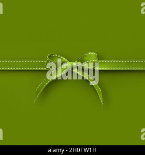 merry christmas gift card with green fabric ribbon bow isolated on green background, top view and copy space template, layout for father day, best wis Stock Photo