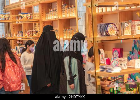 Barcelona, Spain - September 19, 2021: Muslim women wearing a Burka, traditional clothing worn by women in some Islamic countries, are shopping in a s Stock Photo