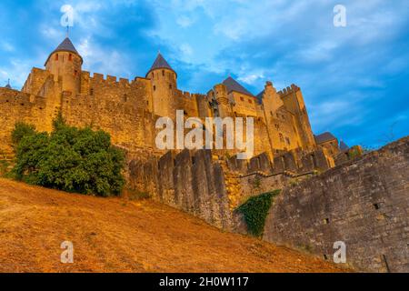 The Ancient Fortress of Carcassonne in the light of the setting sun. French Castle. High quality photo Stock Photo