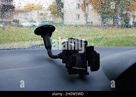 Car phone holder on a windshield close up Stock Photo