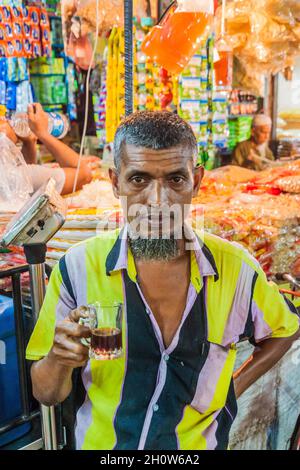 KHULNA, BANGLADESH - NOVEMBER 12, 2016: Local man at a market in Khulna, Bangladesh Stock Photo