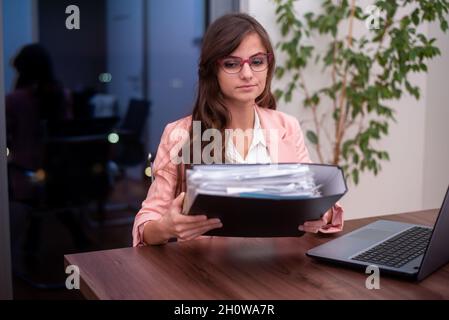 Young business holding binder with business paper Stock Photo