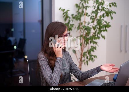 businesswoman talking on her phone Stock Photo