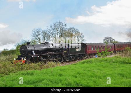 Preserved LMS Black Five 4-6-0 no. 45212 brings up the rear of the Great Britain XI railtour south of Yetminster, Dorset Stock Photo