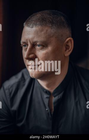 Serious middle-aged man with a deadpan expression Stock Photo