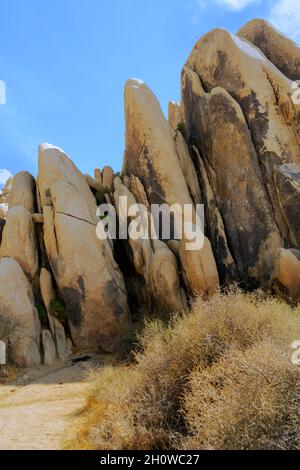 Large vertical rock formation in the Mojave Desert Stock Photo