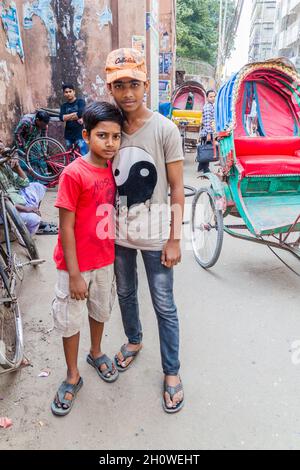 DHAKA, BANGLADESH - NOVEMBER 22, 2016: Two local boys on a street in Old Dhaka, Bangladesh Stock Photo