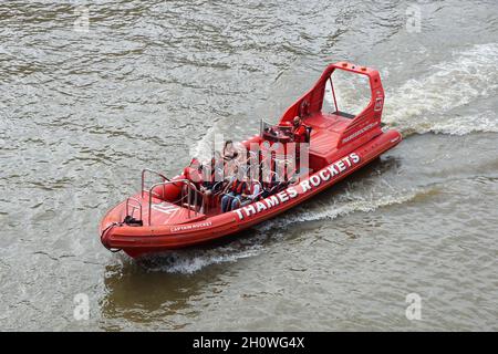 Thames Rockets high speed rigid inflatable boat (RIB) with tourists on the River Thames, London England United Kingdom UK Stock Photo