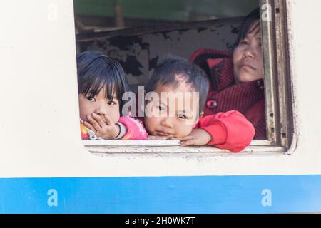 GOKTEIK, MYANMAR - NOVEMBER 30, 2016: Children in a train near Gokteik Gok Teik viaduct, Myanmar Stock Photo