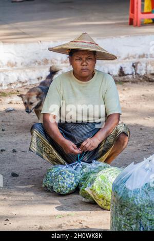 KYAUKME, MYANMAR - NOVEMBER 30, 2016: Vegetable seller on the train station in Kyaukme, Myanmar Stock Photo