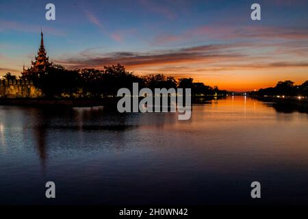 Night view of Mandalay Fortress moat, Myanmar Stock Photo