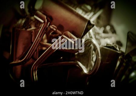 Metal binder clips, also known as foldback clips and bulldog clips, are scattered on a desk, July 20, 2016, in Coden, Alabama. Stock Photo