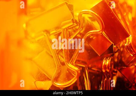 Metal binder clips, also known as foldback clips and bulldog clips, are scattered on a desk, July 20, 2016, in Coden, Alabama. Stock Photo