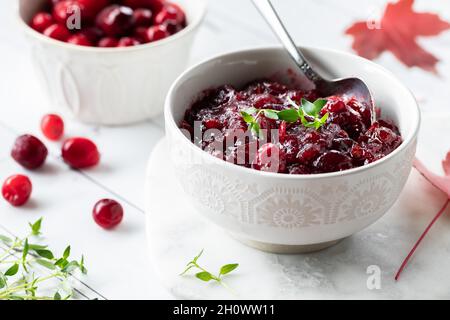 A close up view of a bowl of homemade cranberry sauce for Thanksgiving dinner. Stock Photo