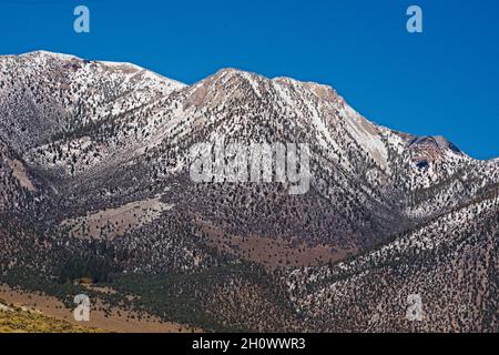 Ridge lines of Eastern Sierras, covered in show. Lines & patterns depicting the shape sand form of majestic mother nature. Expressing huke permanence. Stock Photo