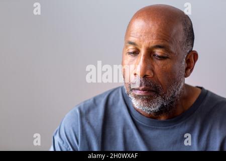 Portrait of a mature man looking sad and away from the camera. Stock Photo