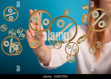 Person presenting the virtual projection of percent signs - sale or discount concept Stock Photo