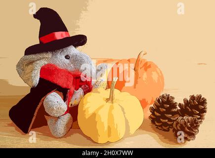 Cute elephant doll in wizard costume with a pair of mini pumpkins and three pine cones on wooden background Stock Photo