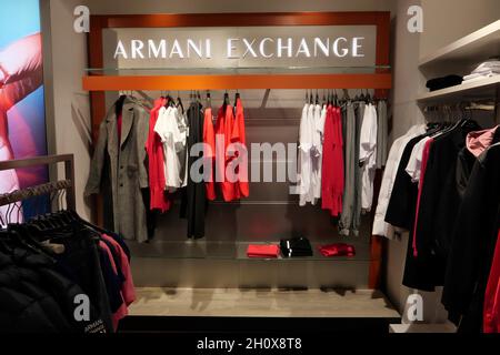 ARMANI EXCHANGE CLOTHING ON DISPLAY INSIDE THE FASHION STORE Stock