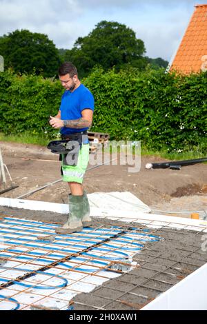 Worker preparing foundations Stock Photo