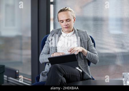 Man using digital tablet Stock Photo