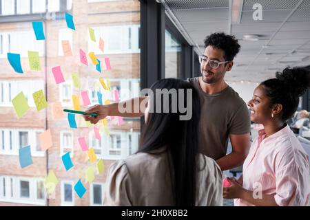 Coworkers having meeting in office Stock Photo
