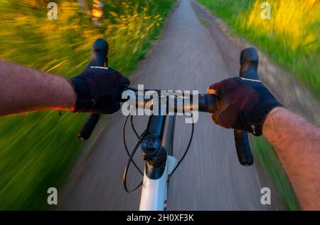 Handlebars of a moving cycle Stock Photo