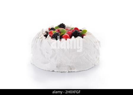 Delicious Pavlova cake with meringue topped and fresh berries isolated on white background Stock Photo