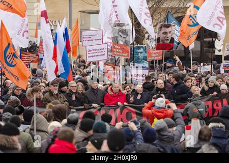 Moscow, Russia. 24th Feb, 2019. Politicians hold flags and banners at the front of the columns of the marchers.Thousands of people marched in Moscow in memory of opposition leader Boris Nemtsov, who was murdered on 27 February 2015. In addition to the traditional liberal activists for this action, the march was attended by libertarians, nationalists and the movement ''Decommunization'' of Dmitry Enteo. (Credit Image: © Mihail Siergiejevicz/SOPA Images via ZUMA Press Wire) Stock Photo