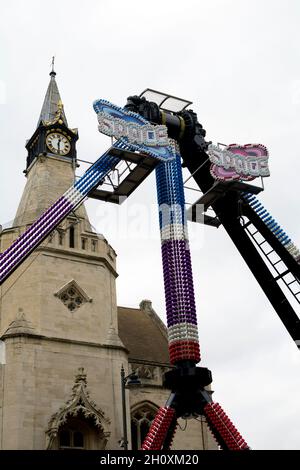 The town hall and a ride at Banbury Michaelmas Mop Fair, Oxfordshire, UK Stock Photo