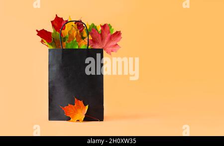Autumn sale banner with colorful leaves, orange background, and ...