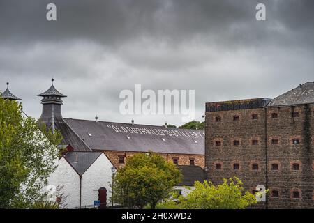 Bushmills, Northern Ireland, Aug 2019 Old Bushmills Distillery sign on a roof of whiskey distillery, popular tourist attraction in County Antrim Stock Photo